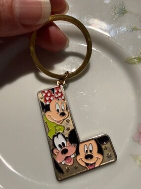 Disney Gold Colored Letter L Keychain with Red, Black, Peach & Green Enamel